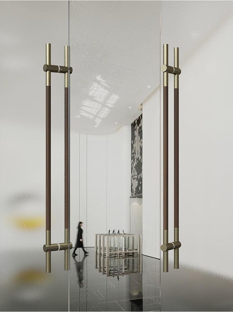 Long door push pull handle made of walnut wood and satin gold metal