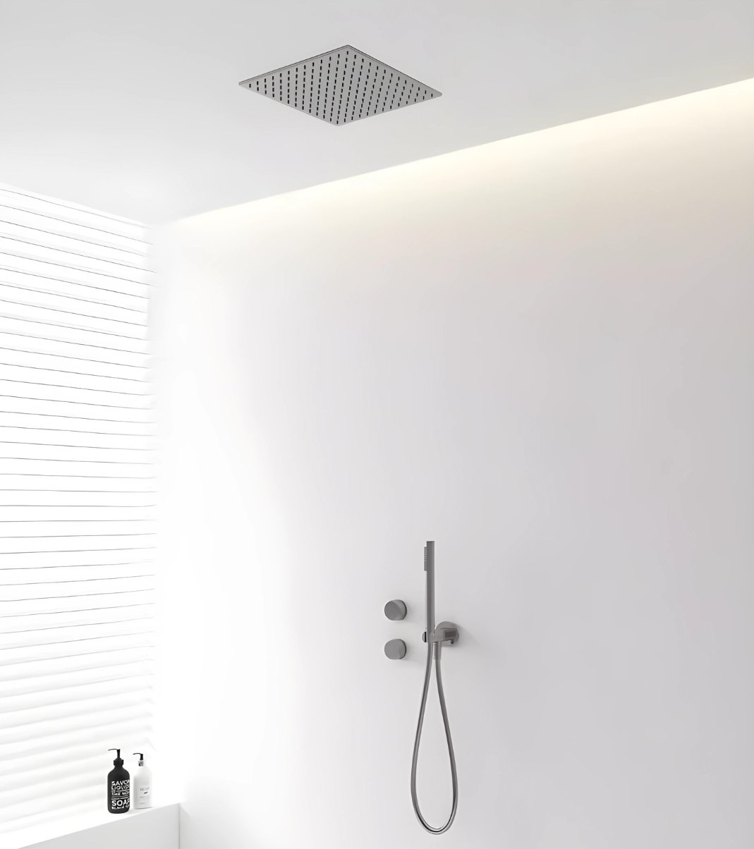A modern matte black knurled texture shower system embedded in a white wall with a ceiling-mounted shower head and a hand-held shower below, set against a minimalist bathroom backdrop.