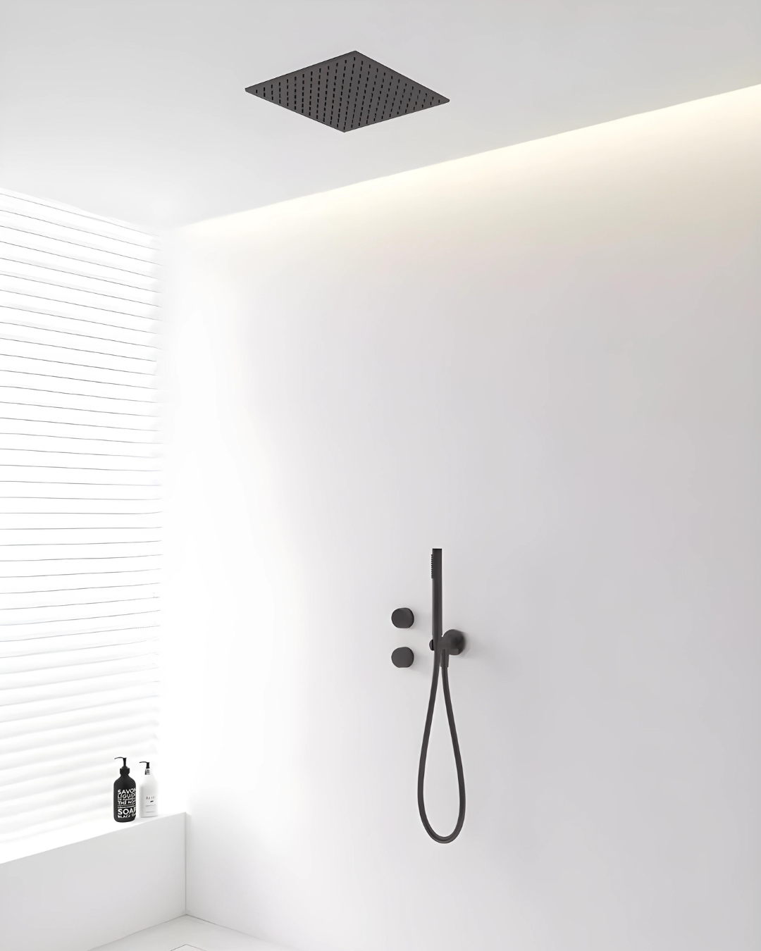 A modern matte black knurled texture shower system embedded in a white wall with a ceiling-mounted shower head and a hand-held shower below, set against a minimalist bathroom backdrop.