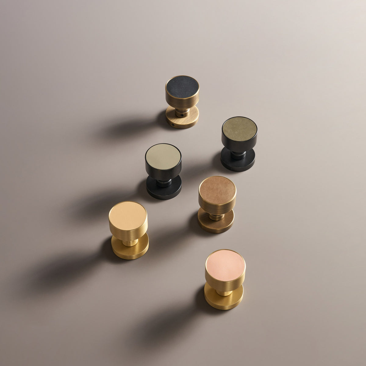 AMORGOS brass door knobs with leather faces in different leathers and finishes