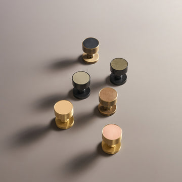 AMORGOS brass door knobs with leather faces in different leathers and finishes