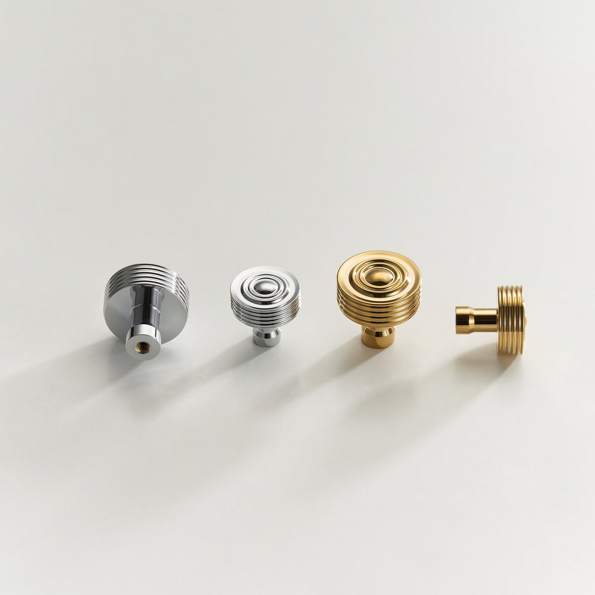 EPIDAVROS ribbed knobs in a row: Chrome 30mm and 25mm, Polished Gold 30mm and 25mm