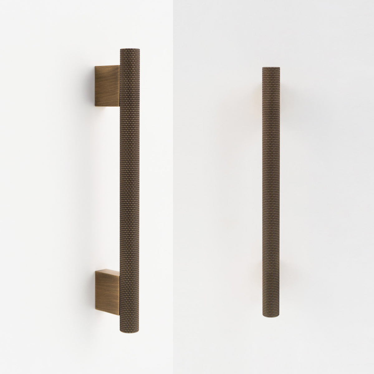 HELIOS knurled brass handle in Antique Brass on white cabinet doors