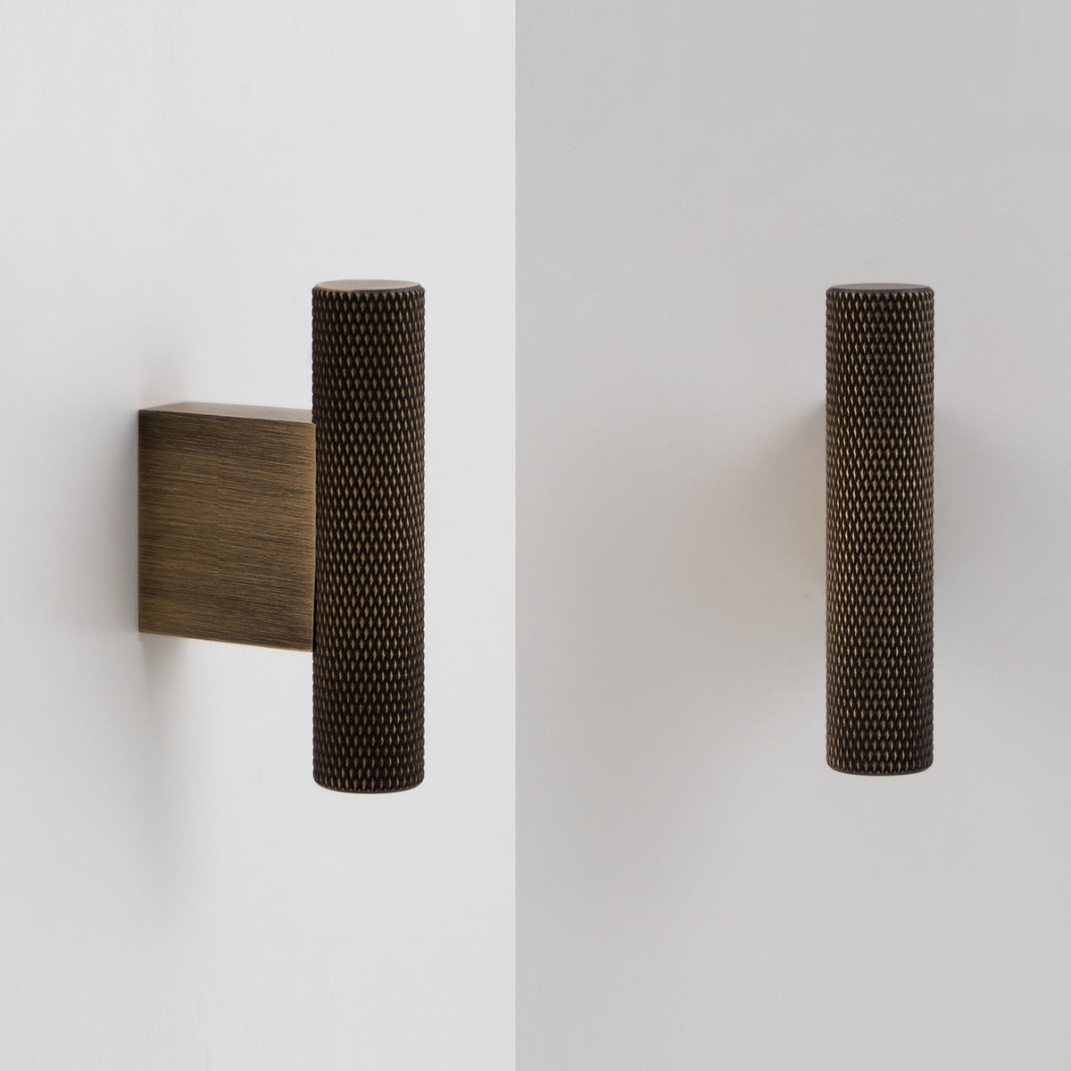 HELIOS knurled brass T-pull in Antique Brass on white cabinet doors