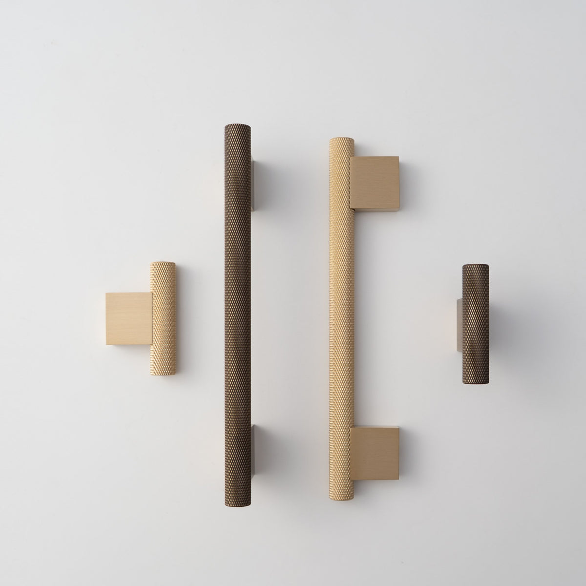 HELIOS knurled brass handles and T-pulls in a row