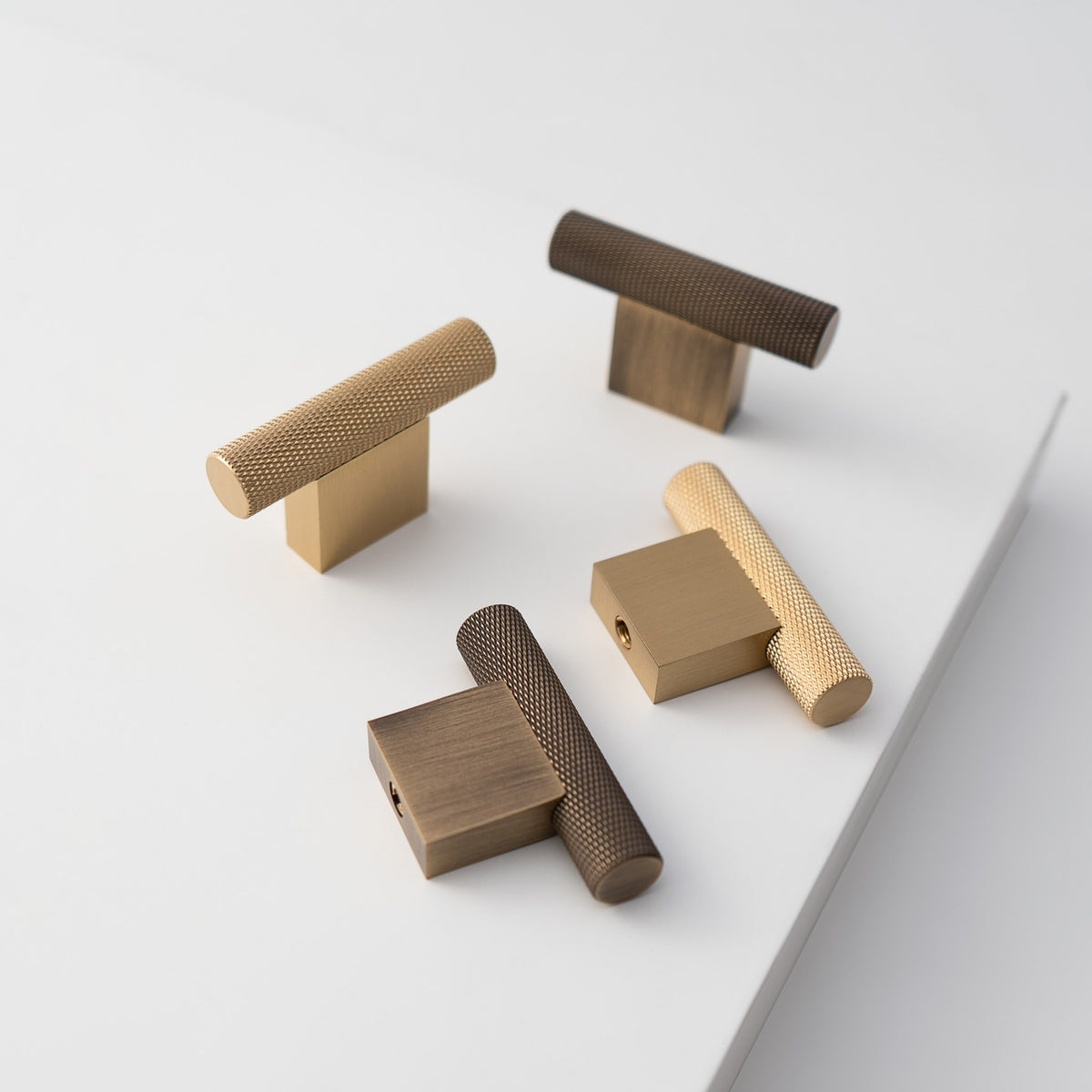 HELIOS knurled brass T-pulls on a white step