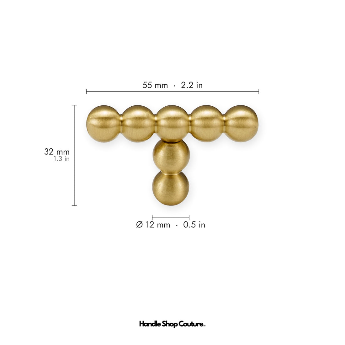 KOMBOLOI beaded brass T-pulls on cream cabinet doors