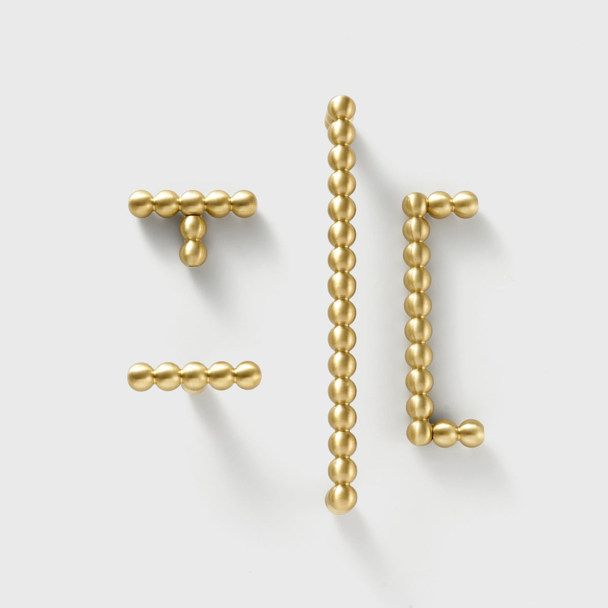 KOMBOLOI beaded brass T-pull and handles in three lengths, flat lay