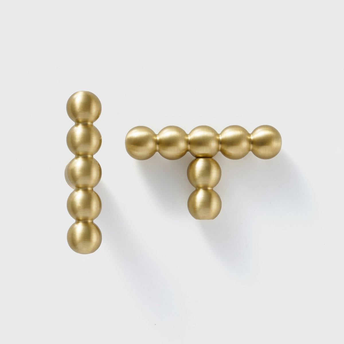 KOMBOLOI beaded brass handle and T-pull close up