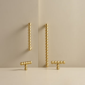 KOMBOLOI beaded brass handles and T-pulls in Satin Brass, studio scene