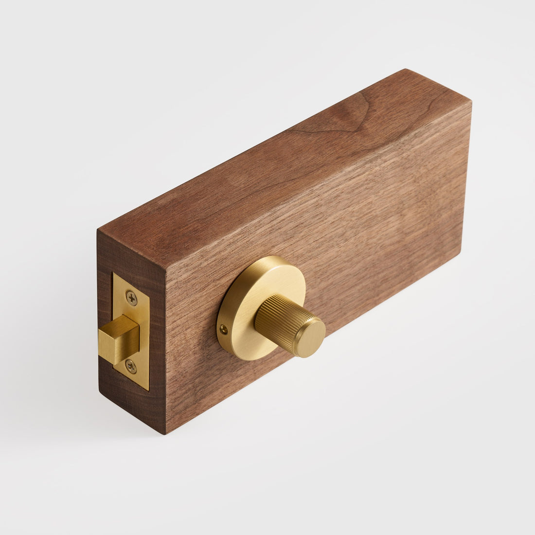 MARBELLA linear knurled brass thumbturns on wood door samples