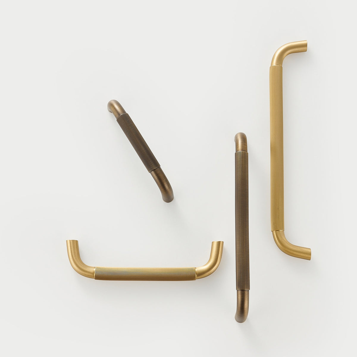 NEMEA reeded brass handles flat lay, Satin Brass and Antique Brass