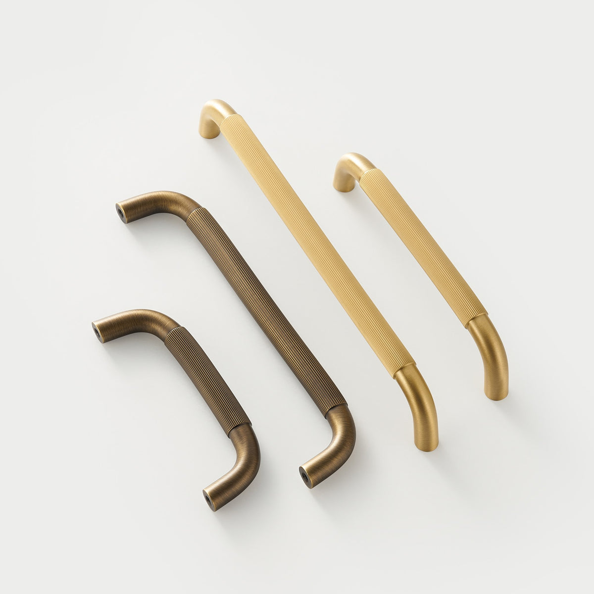 NEMEA reeded brass handles in two lengths, Satin Brass and Antique Brass