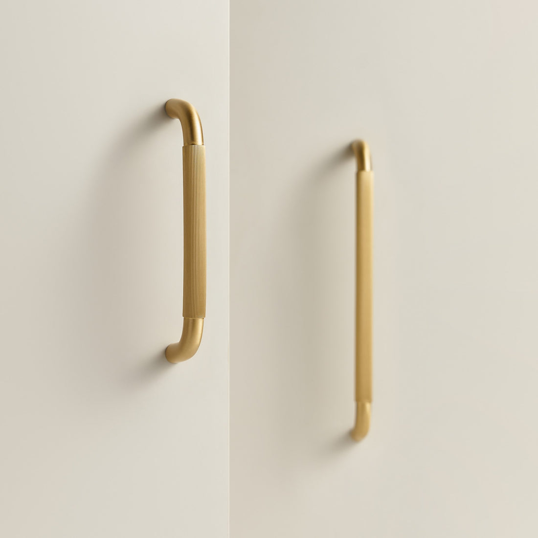 NEMEA reeded brass handles in Satin Brass and Antique Brass on cabinet doors and a stone plinth
