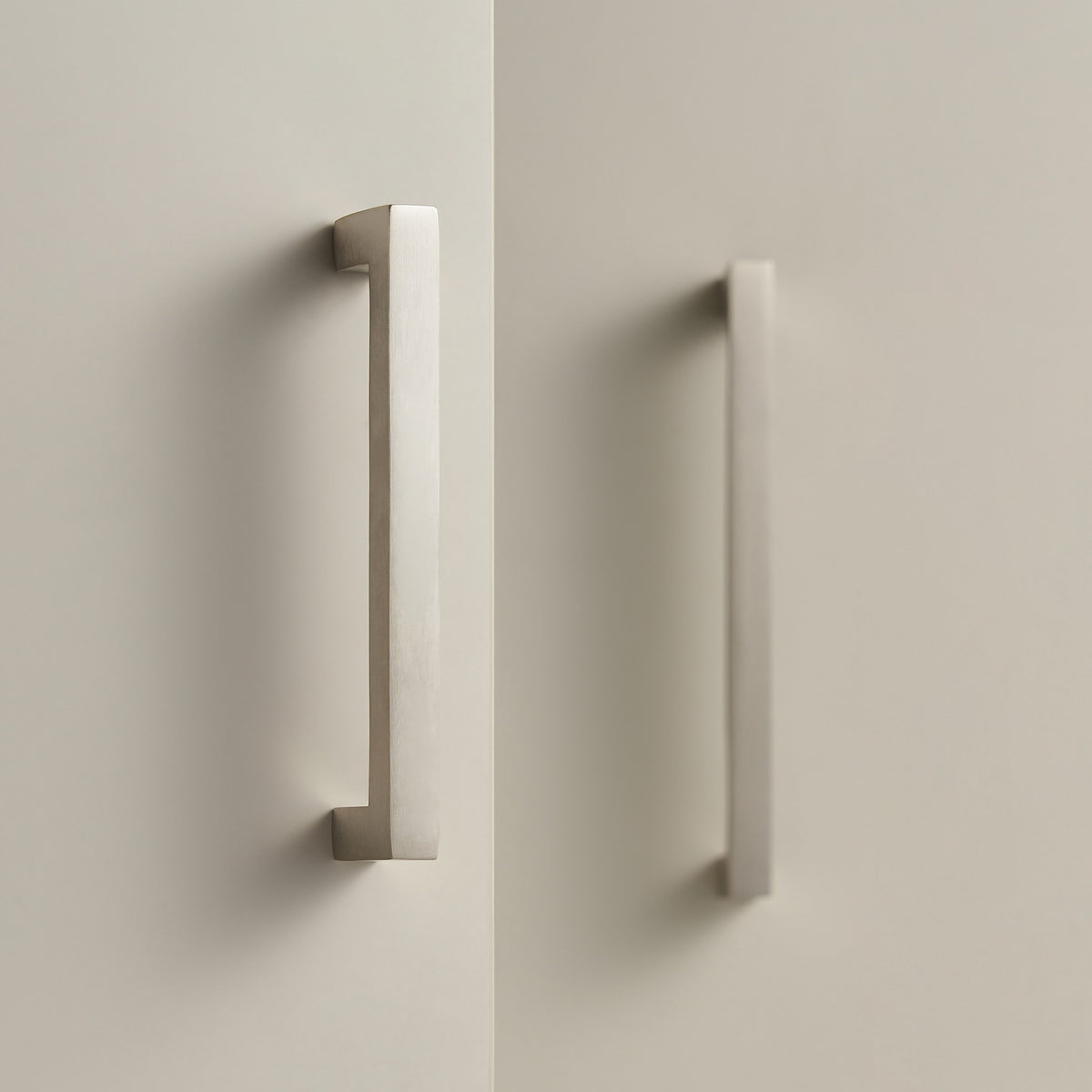 OIA square brass handles in Brushed Nickel on cream cabinet doors