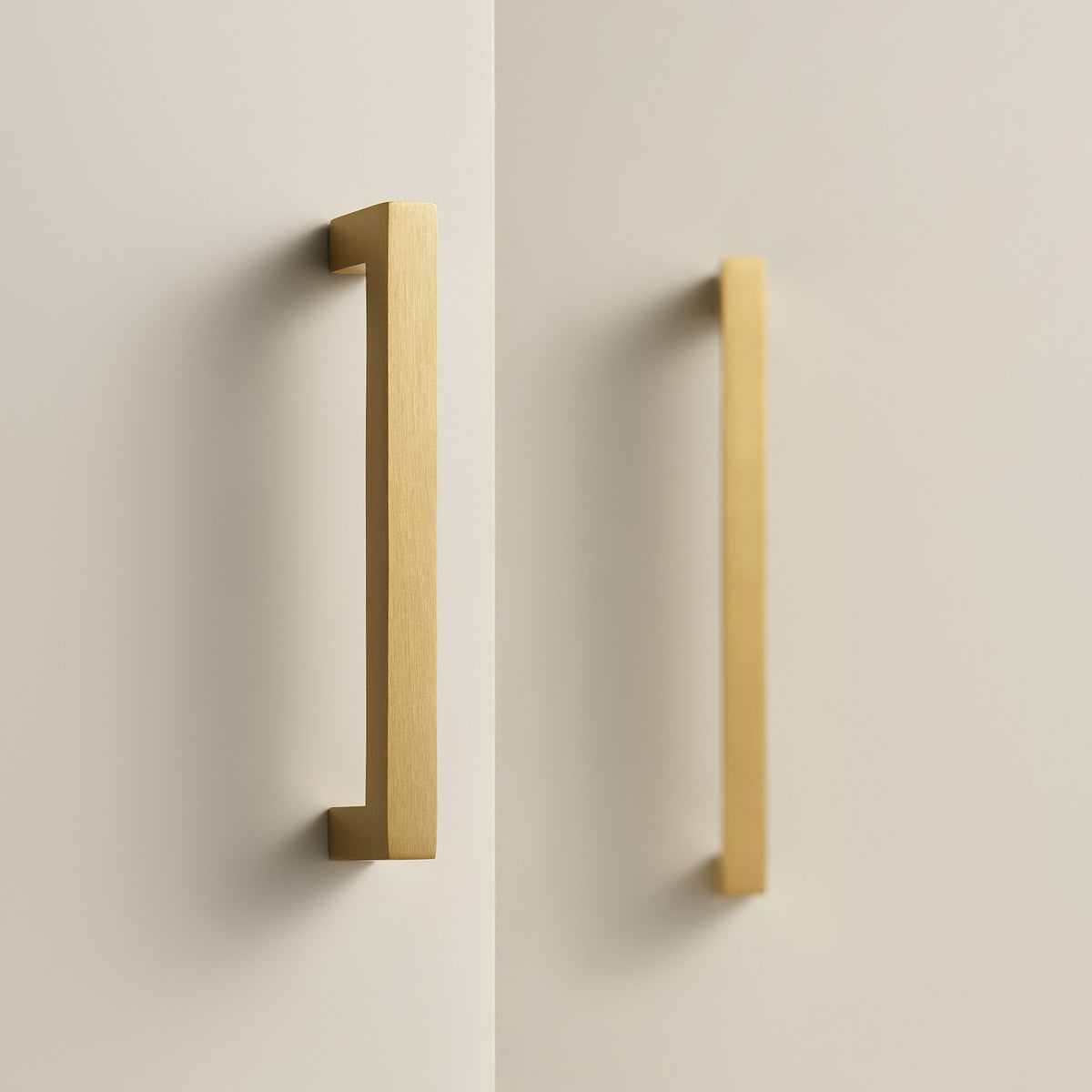 OIA square brass handles in Satin Brass on cream cabinet doors
