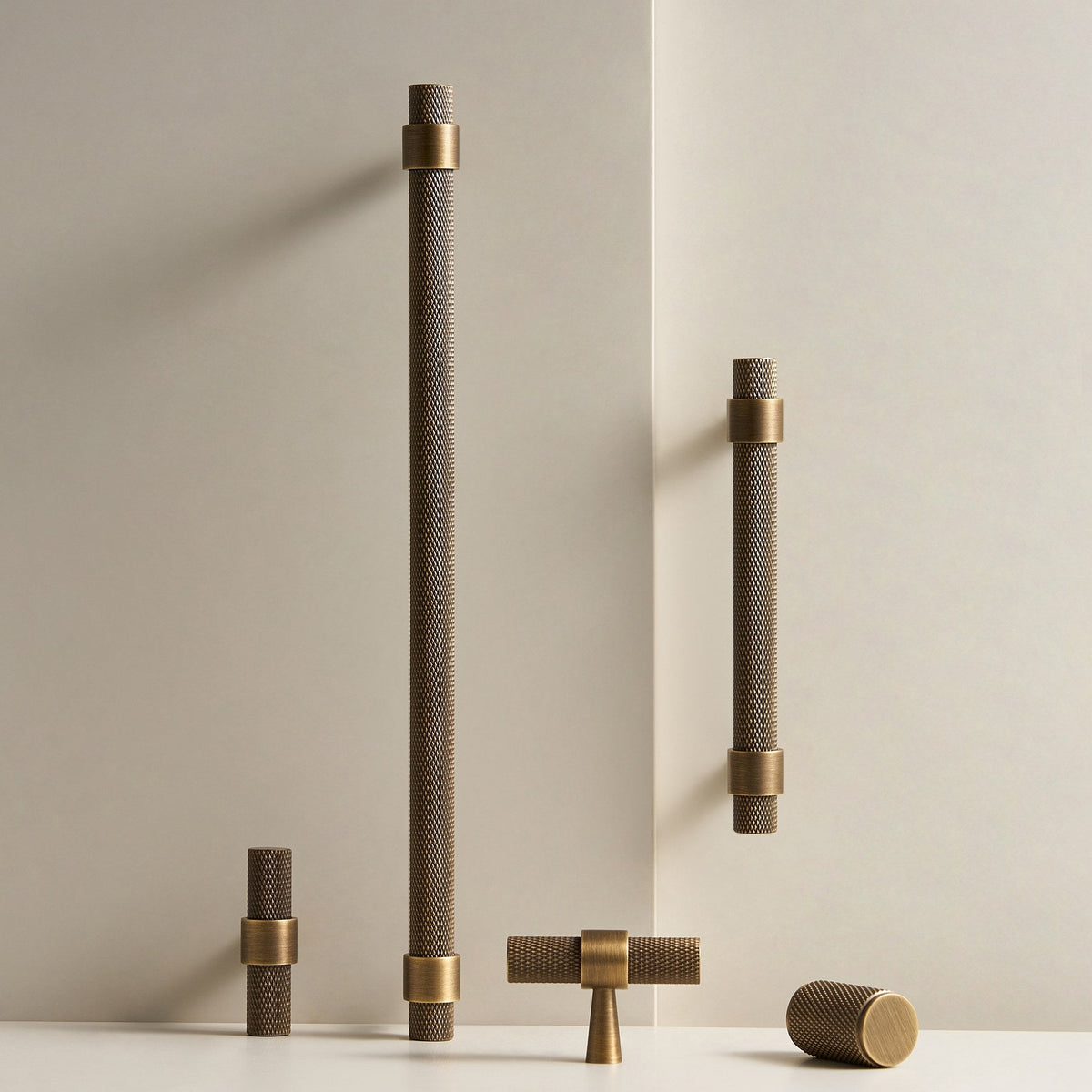 OPORTO knurled handles and T-pull in Antique Brass, standing scene