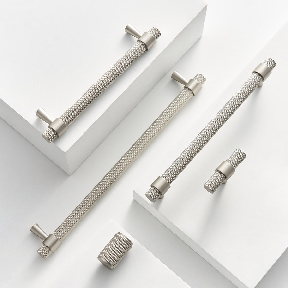 OPORTO knurled handles in Brushed Nickel on white steps