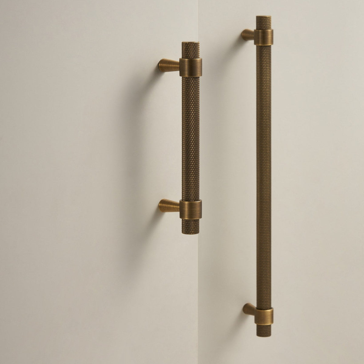OPORTO knurled cabinet handles in Antique Brass on cabinet doors