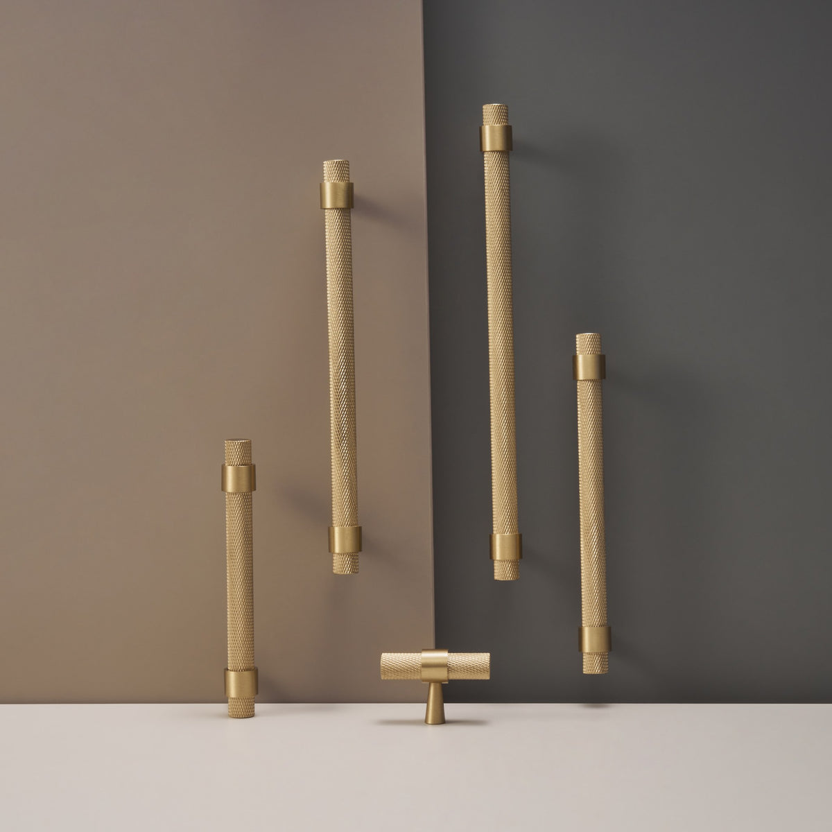 OPORTO knurled cabinet handles in Satin Brass against a two-tone wall