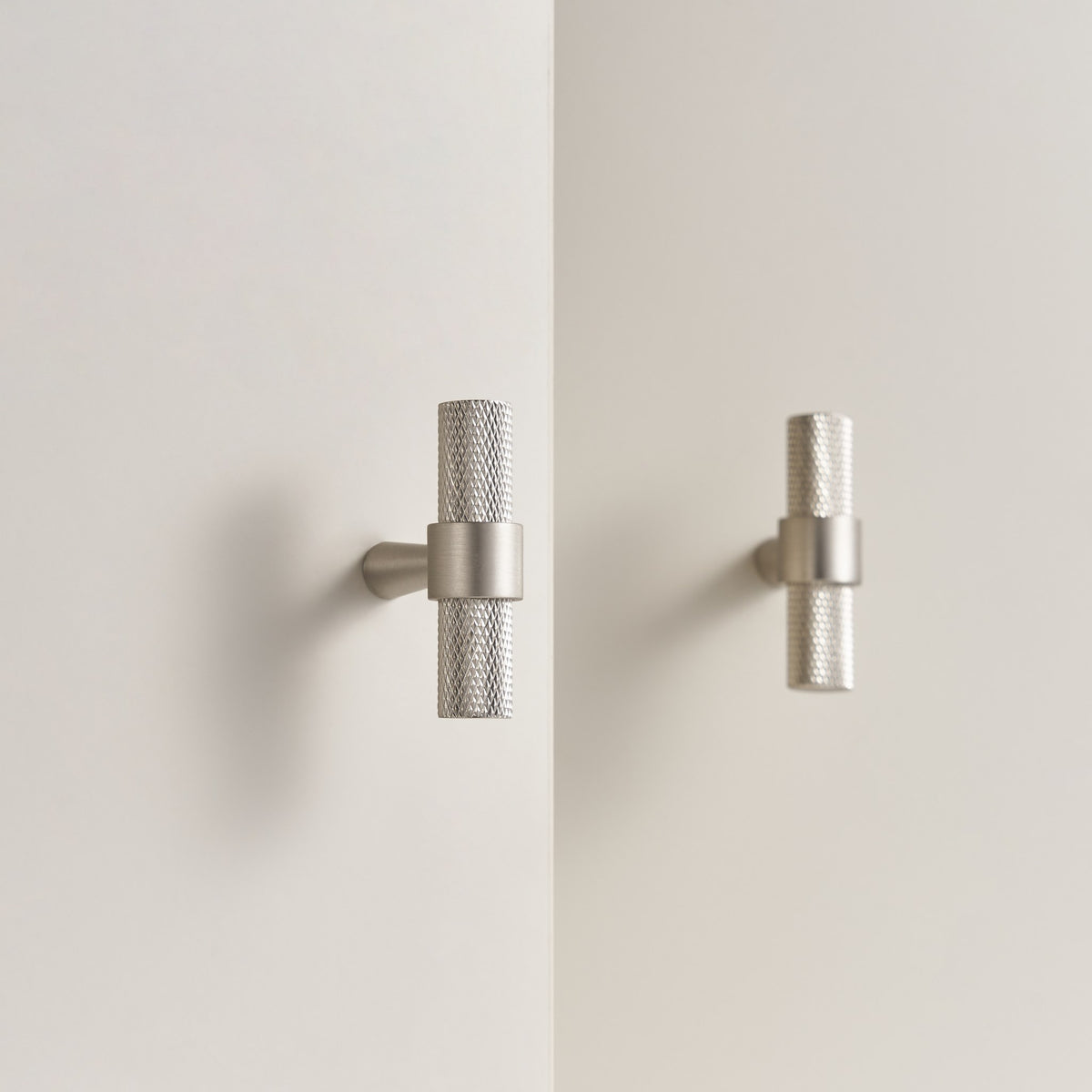 OPORTO knurled T-pulls in Brushed Nickel on cabinet doors