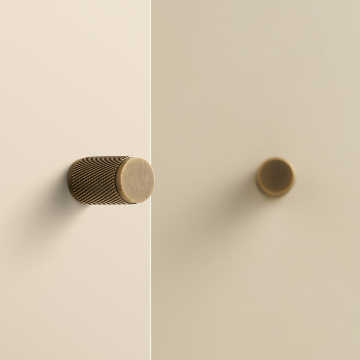 PALENCIA swirled knurl brass knobs in Antique Brass on cabinet doors