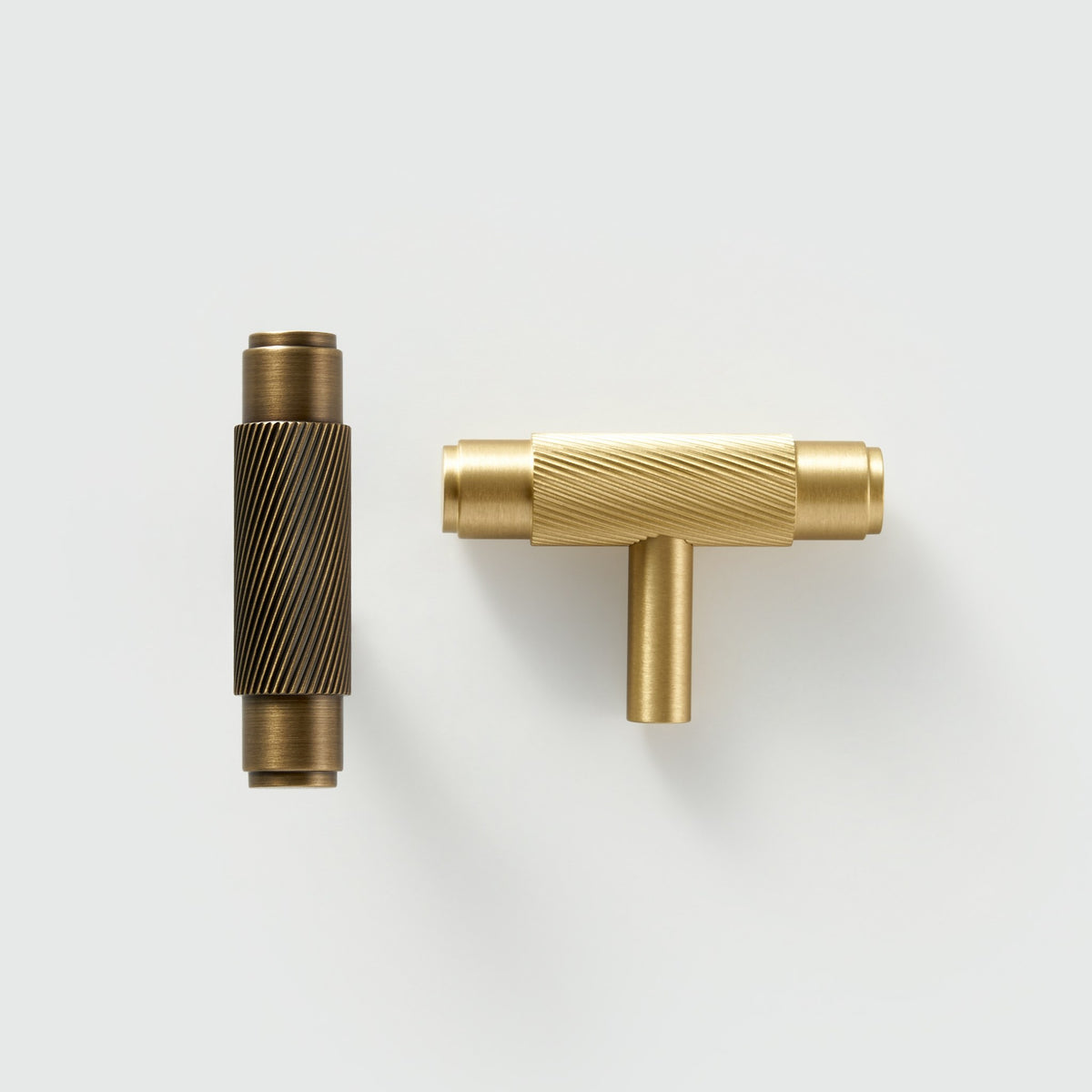 PALENCIA swirled knurl brass T-pull in Antique Brass and Satin Brass