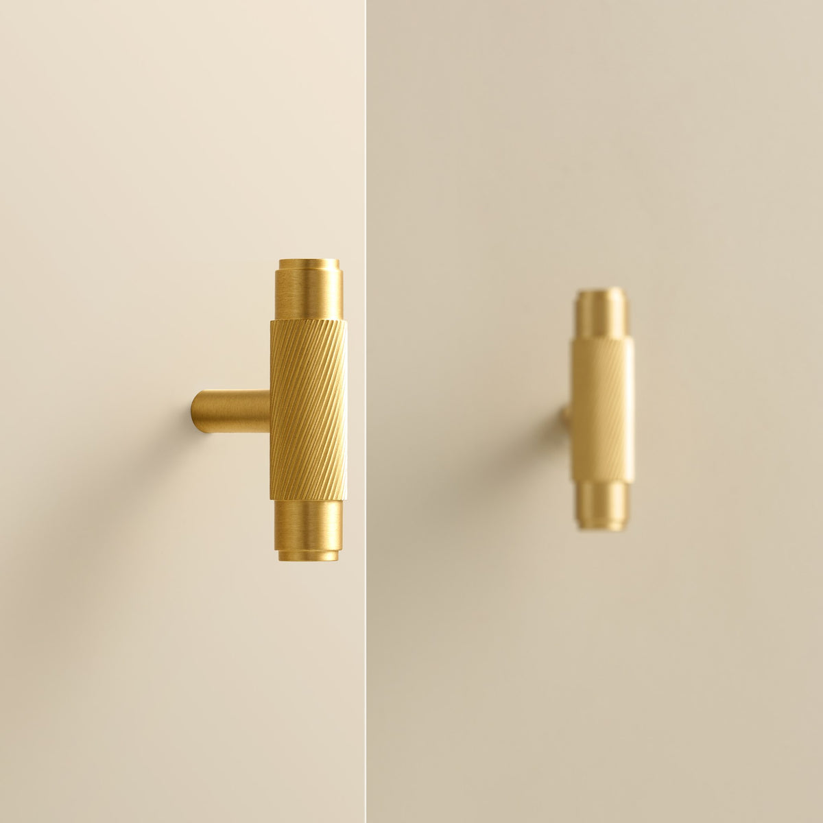 PALENCIA swirled knurl brass T-pulls in Satin Brass on cabinet doors