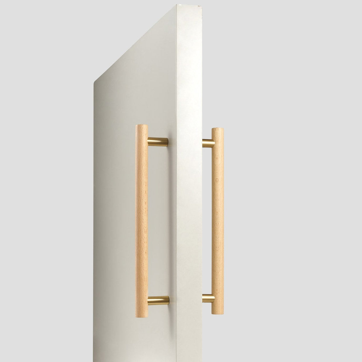 PILIO double-sided beech wood door pull fitted on a door