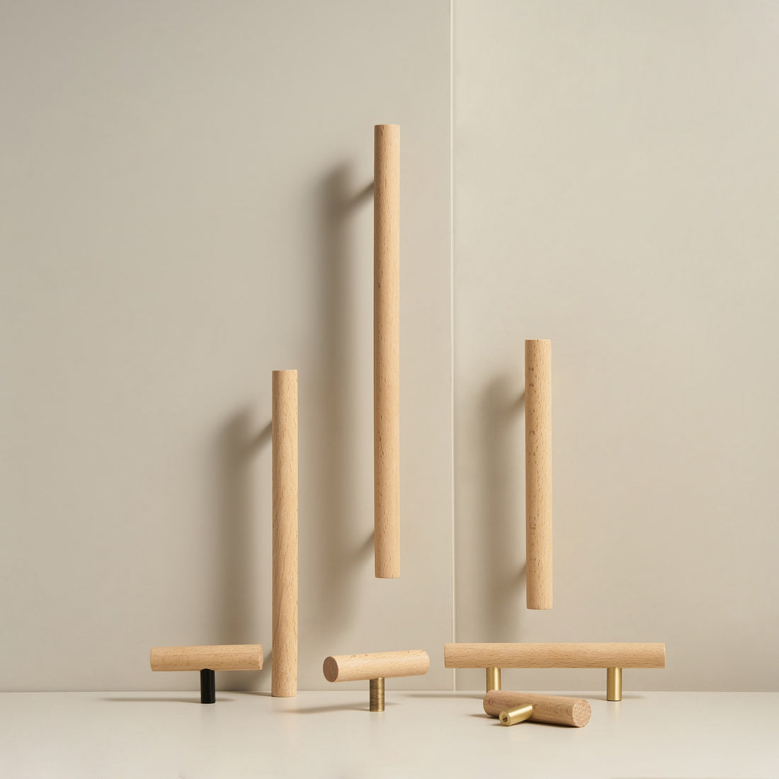 PILIO beech wood handles and T-pulls standing in a studio scene