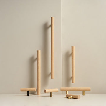 PILIO beech wood handles and T-pulls standing in a studio scene