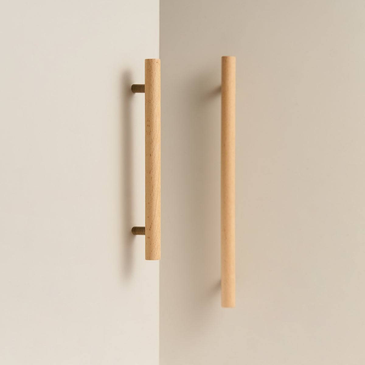 PILIO beech wood cabinet handles with Antique Brass posts on cabinet doors