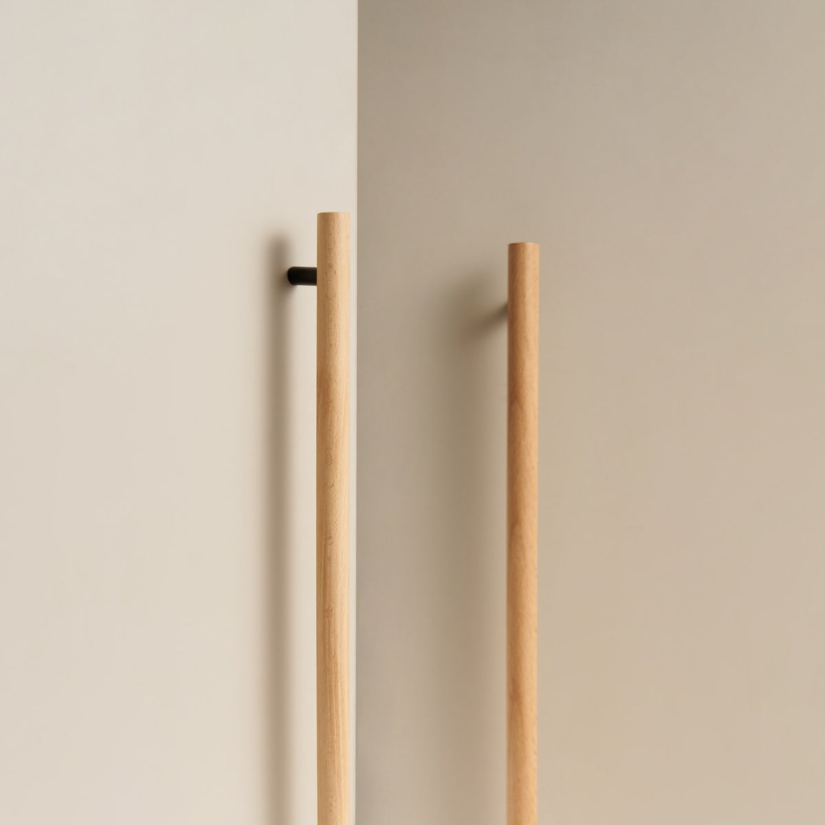 PILIO long beech wood handles with Matte Black posts on wardrobe doors
