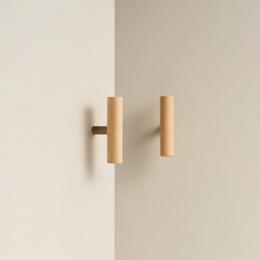 PILIO beech wood T-pull with Antique Brass post on a cabinet door