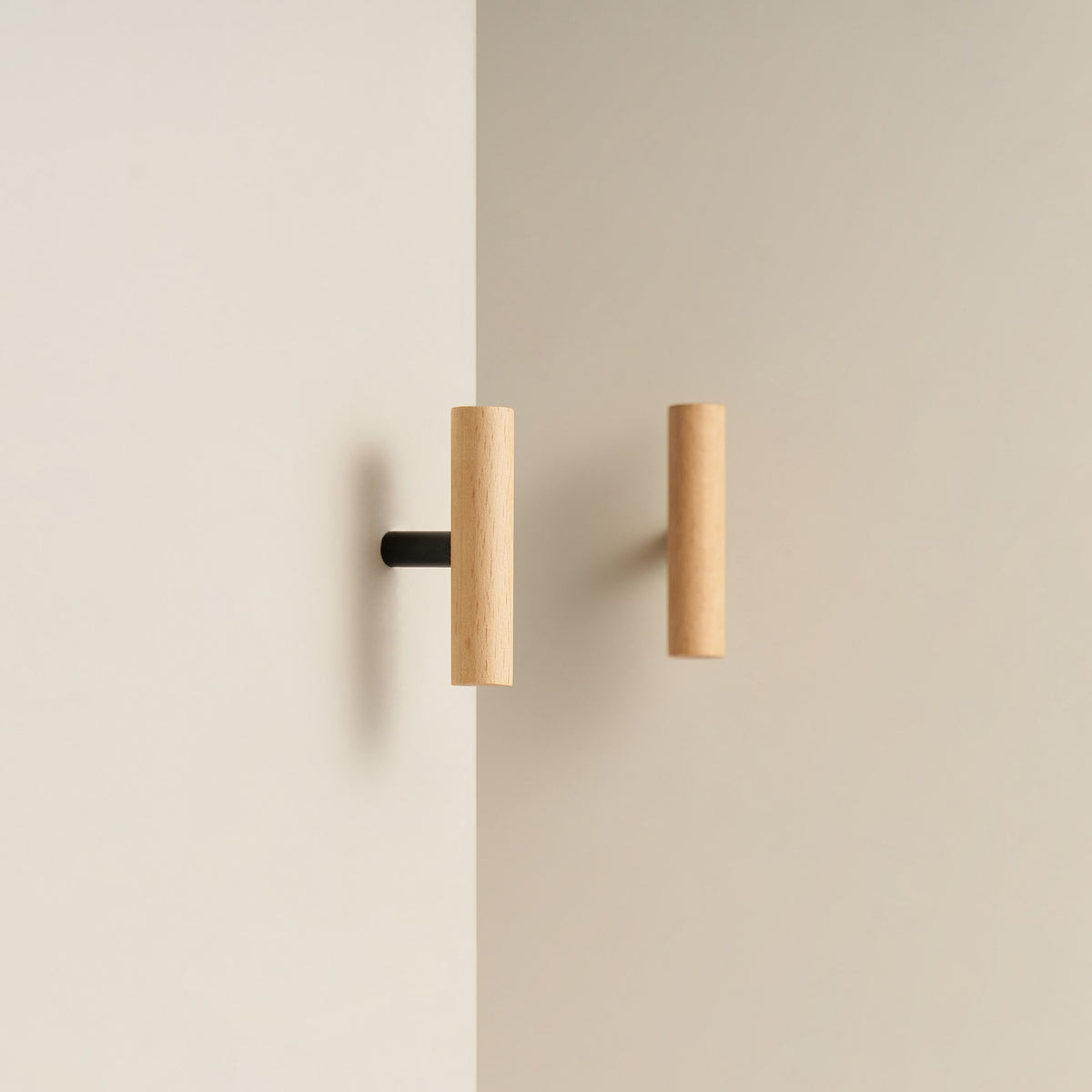 PILIO beech wood T-pull with Matte Black post on a cabinet door