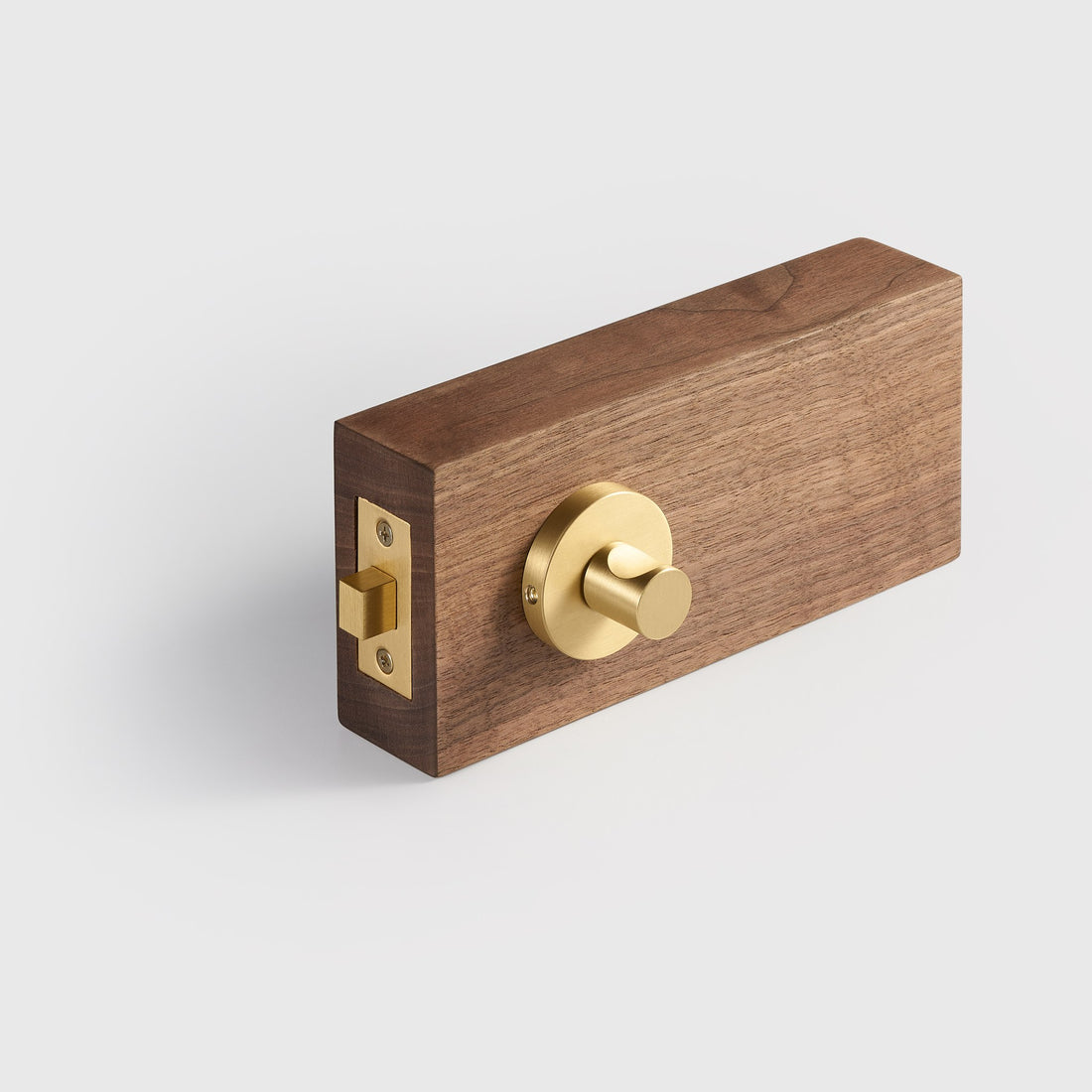 SIFNOS privacy thumbturns in Matte Black, Antique Brass, Brushed Nickel and Satin Brass on wood door samples