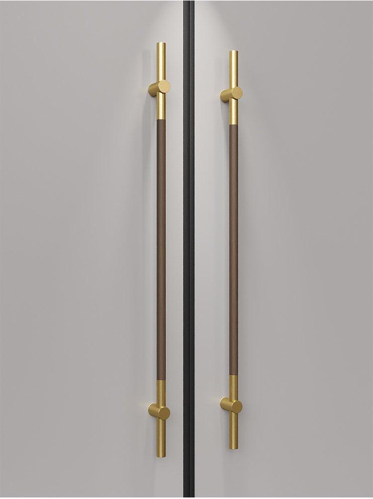 Long door push pull handle made of walnut wood and satin gold metal