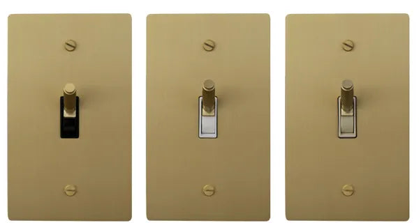 Toggle switch with black, white and ivory switch bodies